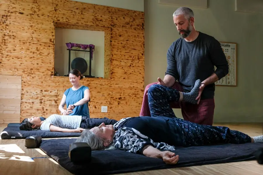 Students practicing at a massage school in Chicago